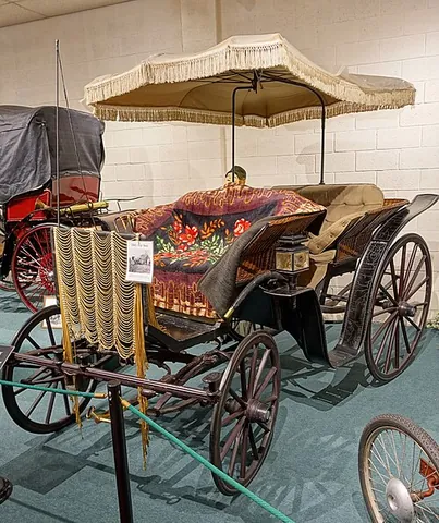 surrey: a light horse-drawn carriage with forward-facing seats accommodating two or four people, popular in...