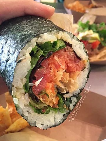 sushi burrito: a dish in Japanese-American fusion cuisine, consisting of sushi ingredients such as raw fish and...