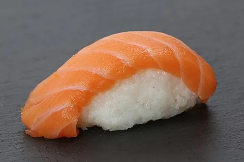 sushi rice: sticky short-grain white rice, steamed and seasoned with sugar and vinegar, especially used in...