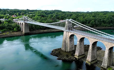 suspension bridge: a bridge whose deck or roadway is suspended from wire ropes (cables) or (for some pedestrian...