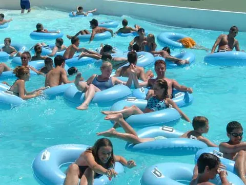 swim ring: an inflatable toroid used as a water toy and to help people to float