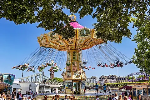 swing ride: an amusement ride consisting of chairs suspended from a carousel