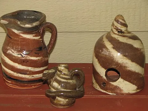 swirlware: a style of pottery with more than one colour of clay swirled into the final result