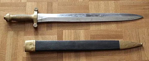 sword: a long bladed weapon with a grip and typically a pommel and crossguard (together forming a hilt),...