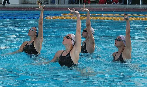 synchronized swimming: a swimming event where swimmers perform a synchronised routine of dance moves in the water
