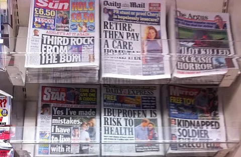 tabloid: a small, compressed portion of a chemical, drug, food substance, etc.; a pill, a tablet
