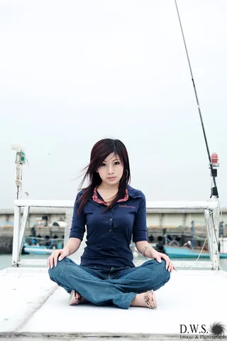 tailorwise: with the legs crossed in front of one and the ankles on the ground
