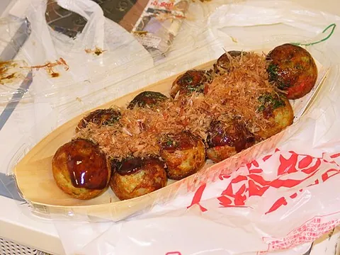 takoyaki: a ball-shaped Japanese dumpling made of batter and filled with diced octopus, tempura scraps,...