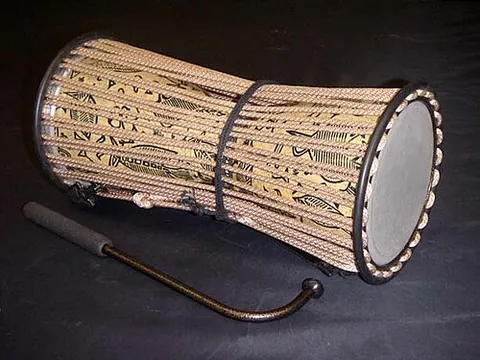 talking drum: any of several drums whose pitch can be regulated by squeezing the sides