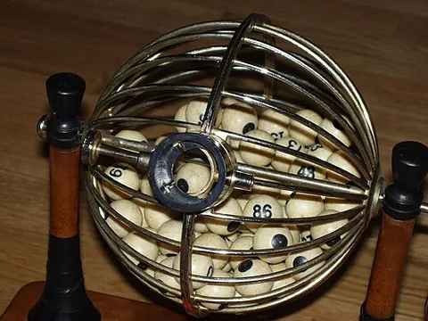tambiolo: a fish bowl or barrel-shaped container where balls used in a raffle or a lottery are placed. In the...