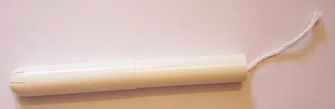 tampon: a plug of cotton or other absorbent material inserted into a body cavity or wound to absorb fluid,...