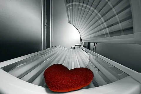 tanning bed: a device emitting ultraviolet radiation used to produce a cosmetic suntan