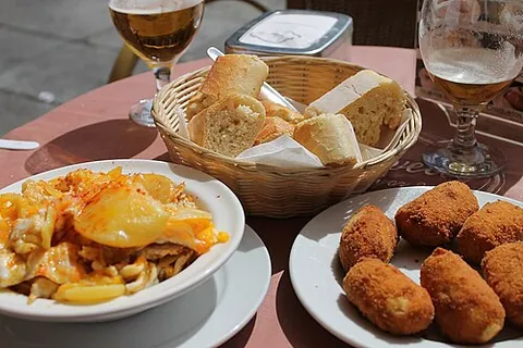 tapas: a variety of Spanish small savoury food items or snacks such as croquettes, cured meat, potato...