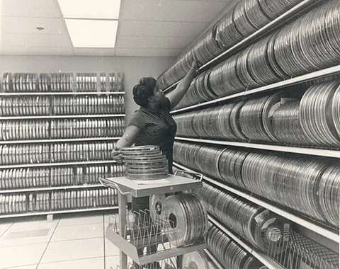 tape library: a device or room holding tape drives for storage purposes