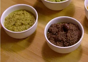 tapenade: a Provençal dish consisting of puréed or finely chopped olives, capers, anchovies, and olive oil,...