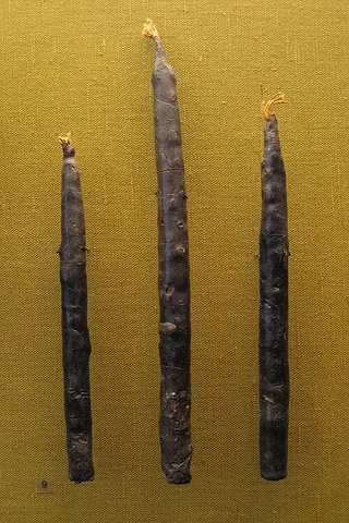 taper candle: a long, narrow cylindrical candle that narrows slightly from a wider base to a conical tip