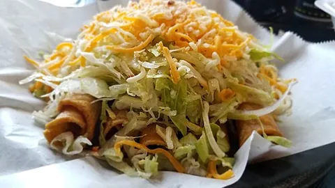 taquito: a fried corn or flour tortilla, filled usually with beef or chicken and cheese, rolled up, and...