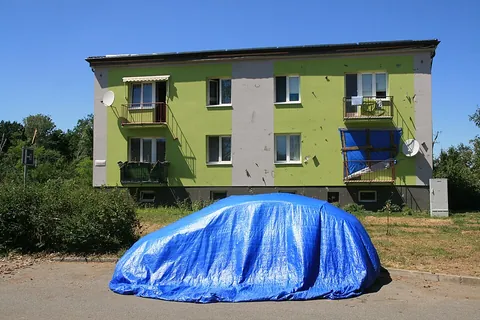 tarpaulin: a heavy, waterproof sheet of material, often cloth or plastic sheet, used as a cover or blanket...