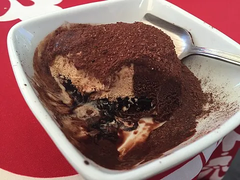 tartufo: an Italian dessert consisting of a ball of ice cream coated in chocolate, with a cherry inside