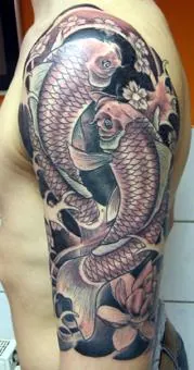 tattoo: an image made on a body part, usually the skin with ink and a needle