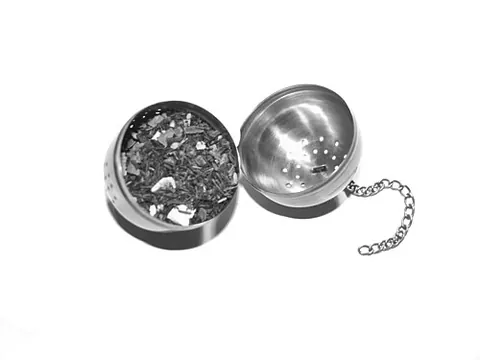 tea ball: a perforated spherical metal container that holds tea leaves for steeping or brewing in hot water