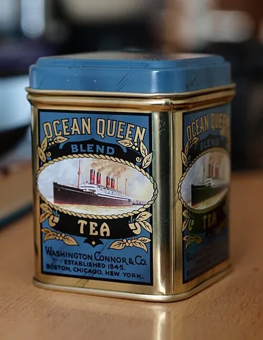 tea caddy: a box, jar, pot, or tin used to store tea leaves