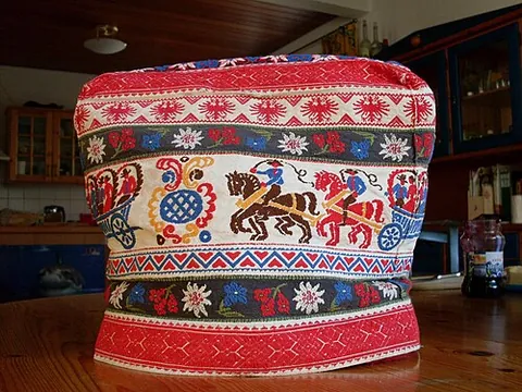 tea cosy: an insulating cloth covering, shaped to fit over a teapot to maintain warmth