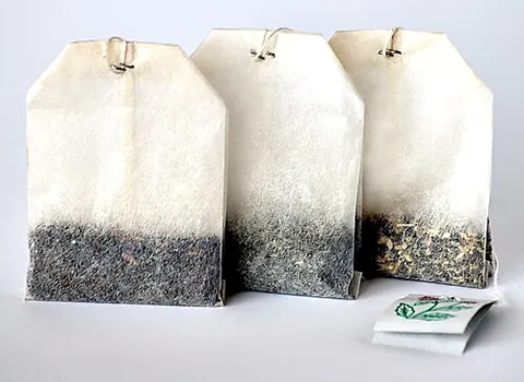 teabag: a cloth or paper sachet containing tea leaves or herbal tea, designed to act as an infuser when...