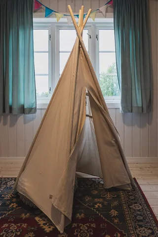 teepee: a cone-shaped tent traditionally used by many native peoples of the Great Plains of North America