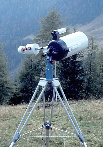 telescope: a monocular optical instrument that magnifies distant objects, especially in astronomy