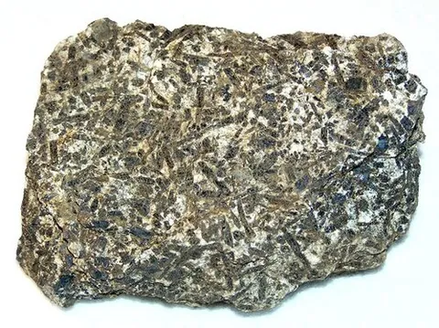 teschenite: any of a group of rocks containing essential pyroxene, olivine, and analcime