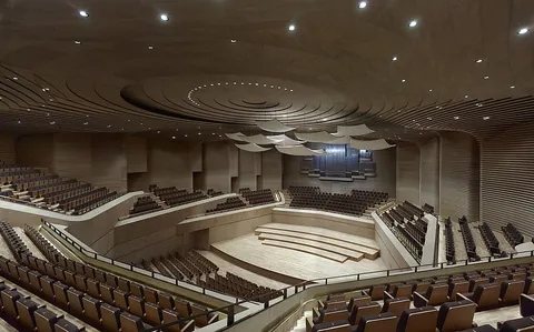 theater: a place or building, consisting of a stage and seating, in which an audience gathers to watch...