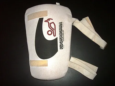 thigh pad: a protective garment usually worn by football players over the thighs