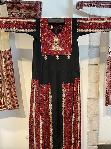 thobe: an ankle-length robe with long sleeves, worn by some Arab men and traditionally by Palestinian women