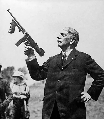 thompson submachine gun: a .45-caliber American submachine gun, having a wooden stock and a drum, stick, or box magazine