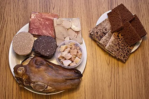 thorramatur: a selection of Icelandic foods, mostly cooked meat and fish products, served with rye bread and...