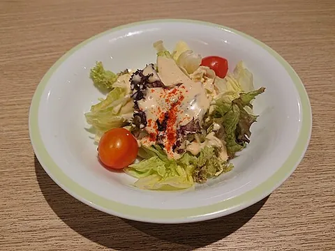 thousand island dressing: a salad dressing of mayonnaise, ketchup, Tabasco sauce and finely chopped vegetables