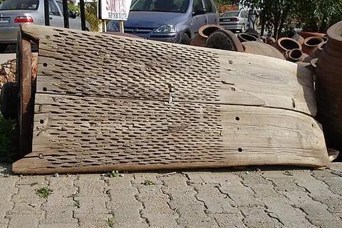 threshing sledge: a rectangular wooden plank designed to separate grain from chaff