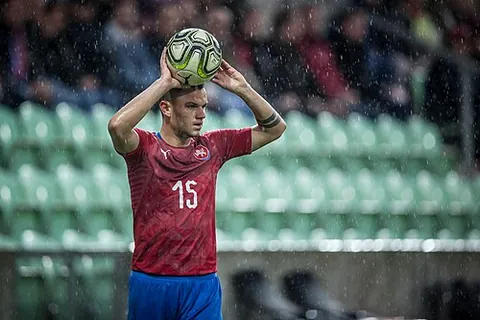 throw-in: a set-piece where the ball is thrown back into play