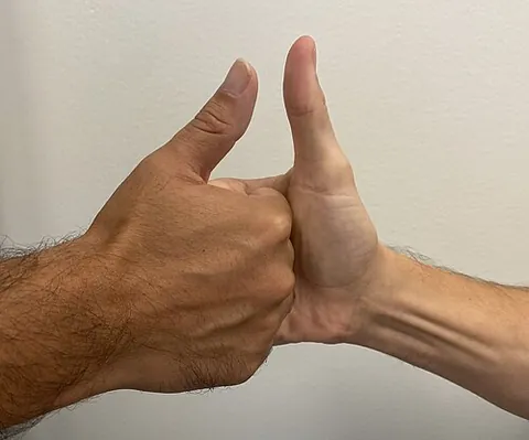 thumb war: a children's game in which the two opponents interlock each other's right- or left-handed fingers,...