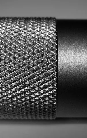 thumbnut: a nut with a knurled rim which can be turned with thumb and forefinger