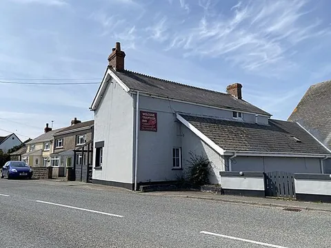 tiers cross: a village and community north of Milford Haven, Pembrokeshire, Wales (OS grid ref SM9010)