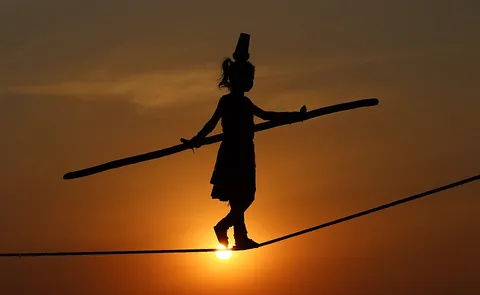 tightrope: a tightly stretched rope or cable on which acrobats perform high above the ground