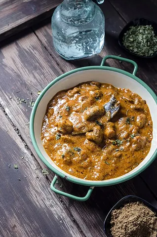 tikka masala: of a style of Indian dish in which the main ingredient (such as chicken) is marinated, usually (but...
