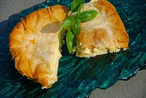 tiropita: a Greek pastry with layers of buttered phyllo, filled with a cheese-egg mixture