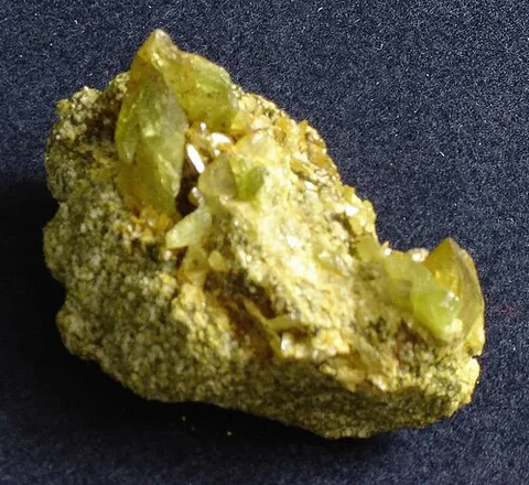 titanite: a mixed calcium and titanium neosilicate, CaTiSiO₅, once known as sphene