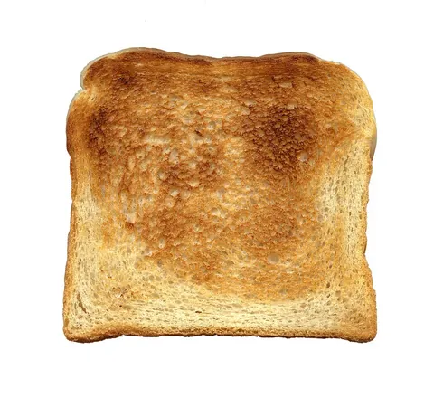 toast: bread that has been toasted (cooked lightly by browning)