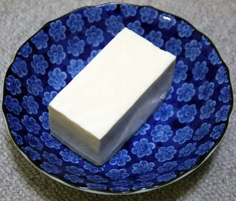 tofu: a protein-rich food made from curdled soy milk