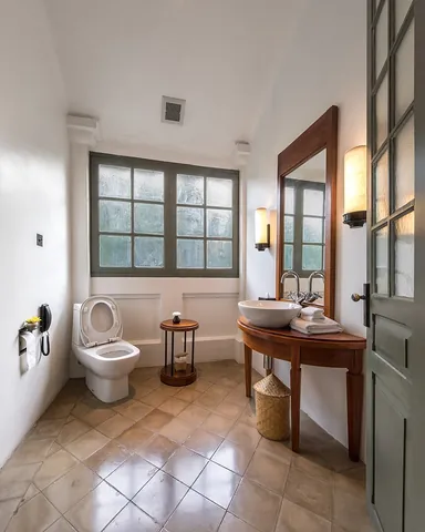 toilet: a room, enclosed area or single-purpose building containing a fixture or fixtures used for...
