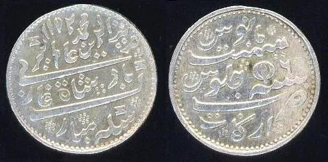 tola: a unit of mass used in India, equal to the mass of a silver rupee coin, fixed at 180 troy grains...